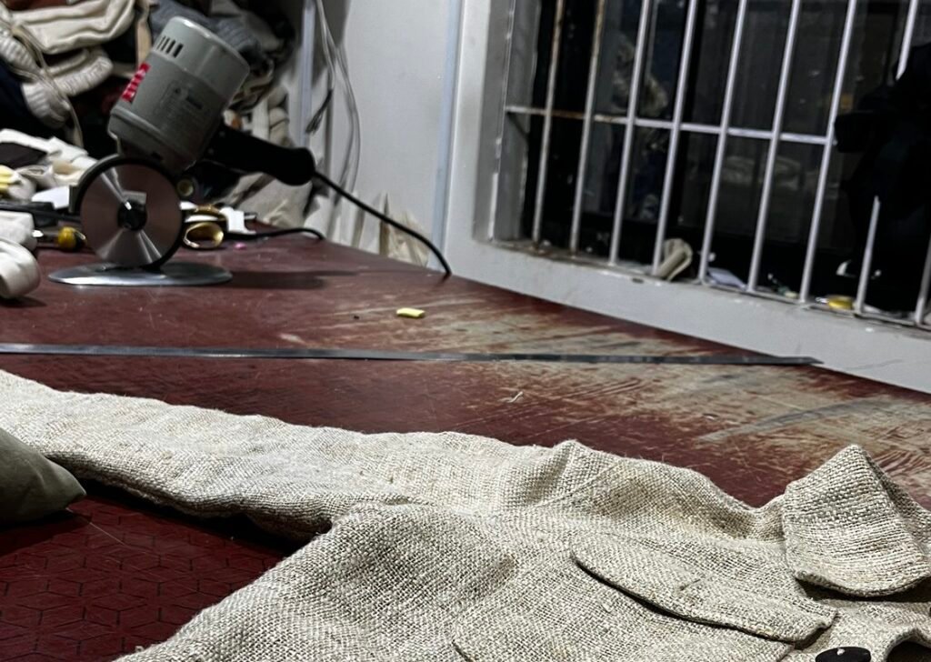 Rotary fabric cutter and offcuts in the Kathmandu workshop where the hemp chore jacket is made