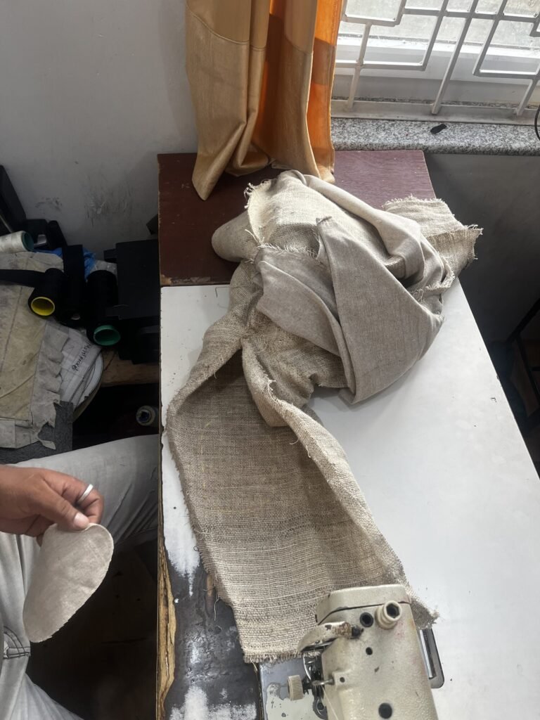 Cut cotton elbow patch piece before stitching, hemp chore jacket rework