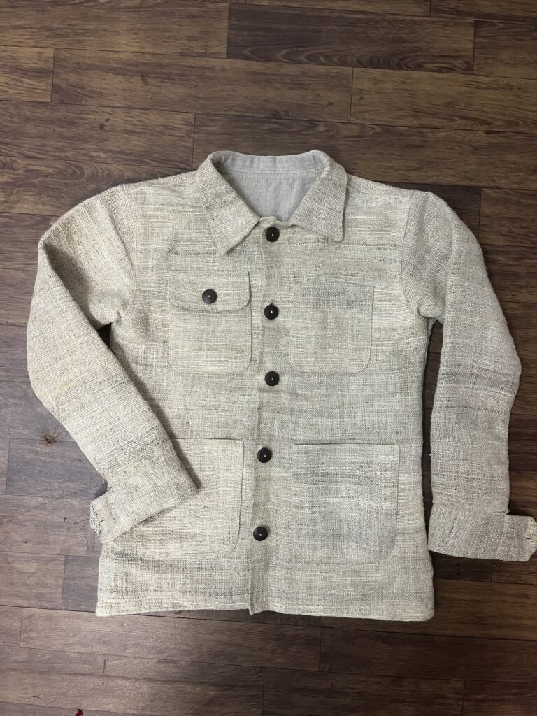 Reworked handwoven hemp chore jacket sample (V2), front view, undyed hemp shell with new longer cuffs